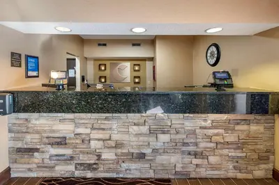 a lobby of a hospital with a stone counter at Comfort Inn Shelbyville North in Shelbyville