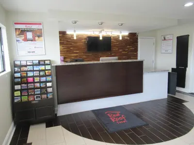 a waiting area in a restaurant with a cash register at Red Roof Inn Walton, KY - Richwood - Cincinnati Airport South in Richwood