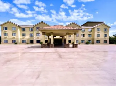 a large building with a gazebo in front of it at Comfort Suites Georgetown in Georgetown