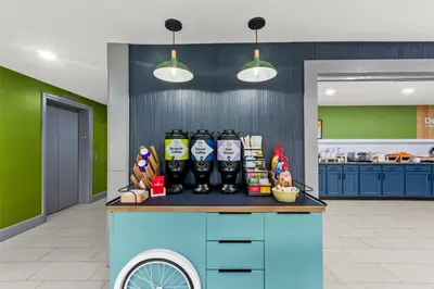 a counter with a bunch of soda bottles on it at Spark by Hilton Lexington Hamburg in Lexington