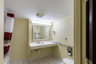 a bathroom with a sink and a mirror at Red Roof Inn Morehead in Morehead