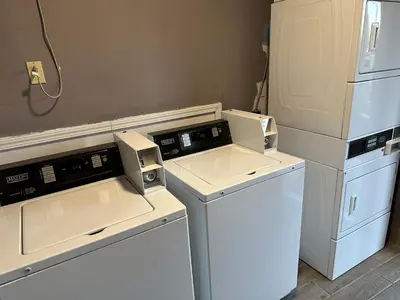 a kitchen with white appliances and a refrigerator at Quality Inn Ashland in Ashland