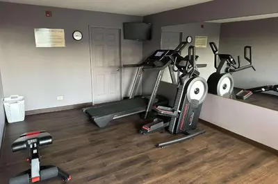 a gym with three exercise bikes in a room at Quality Inn Ashland in Ashland