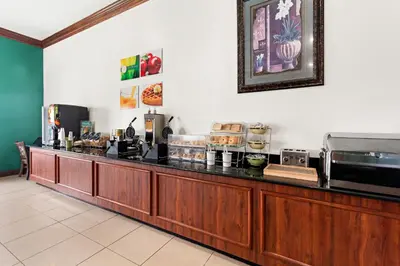 a restaurant with a counter with food on it at Quality Inn Dry Ridge in Dry Ridge