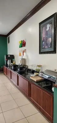 a reception desk in a restaurant with a counter at Quality Inn Dry Ridge in Dry Ridge