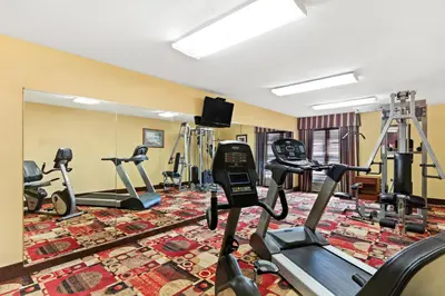 a fitness room with treadmills and exercise bikes at Quality Inn Dry Ridge in Dry Ridge