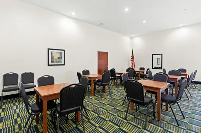 a classroom with tables and chairs in a room at Quality Inn Dry Ridge in Dry Ridge