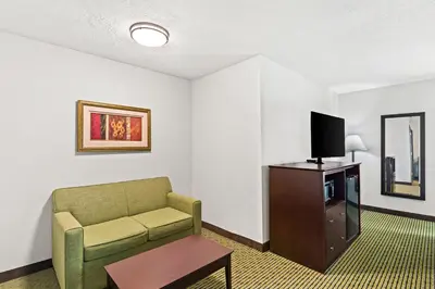 a living room with a couch and a tv at Quality Inn Dry Ridge in Dry Ridge