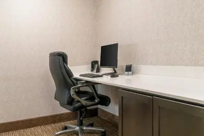 an office with a desk with a computer and a chair at Quality Inn & Suites Monroe in Monroe