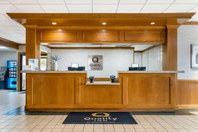 a lobby of a dental office with a reception counter at Quality Inn & Suites Monroe in Monroe