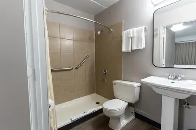 a bathroom with a toilet and a sink and a shower at Motel 6-Cincinnati, OH in Cincinnati