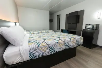 a hotel room with a bed and a television at Motel 6-Cincinnati, OH in Cincinnati