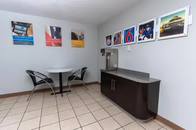 a room with a counter and a table and a refrigerator at Motel 6-Cincinnati, OH in Cincinnati