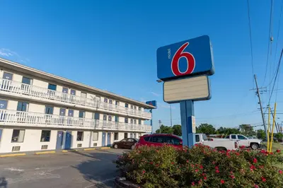 a gas station sign in front of a building at Motel 6-Cincinnati, OH in Cincinnati