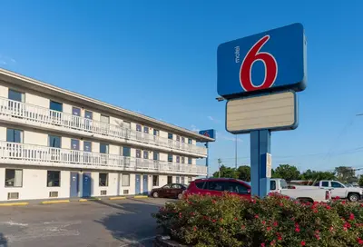 a gas station sign in front of a building at Motel 6-Cincinnati, OH in Cincinnati