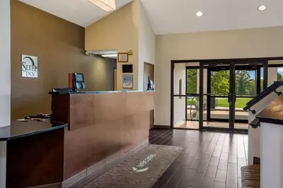 a lobby of a hotel with a reception desk at Sleep Inn Bolivar in Bolivar