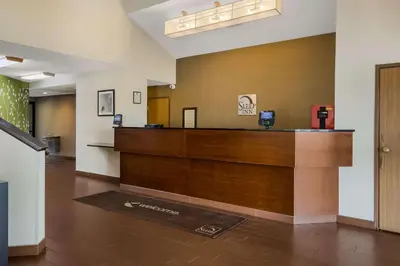 a lobby with a reception desk in a hotel room at Sleep Inn Bolivar in Bolivar