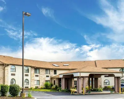 a building with a light pole in front of it at Quality Inn Elyria in Elyria