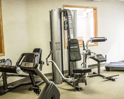 a gym with two exercise bikes and a treadmill at Quality Inn Elyria in Elyria