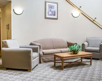 a waiting room with couches and a coffee table at Quality Inn Elyria in Elyria