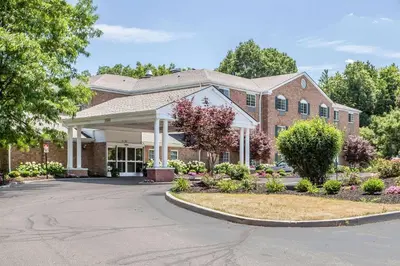 a large brick building with a driveway at Comfort Inn Independence - Cleveland in Independence