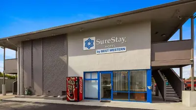 a building with a synergy fuel test museum at SureStay Hotel by Best Western Findlay in Findlay