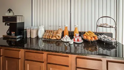 a counter top with food on it in a kitchen at SureStay Hotel by Best Western Findlay in Findlay