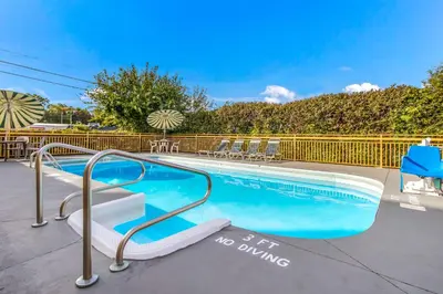 a swimming pool with a no entry sign next to it at Econo Lodge in Norwalk