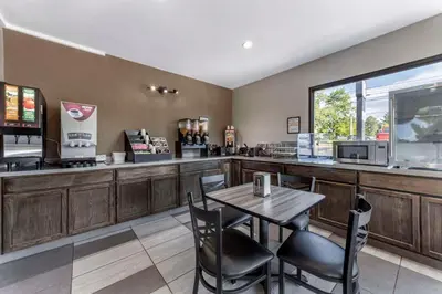 a fast food restaurant with a table and chairs at Econo Lodge Wooster in Wooster