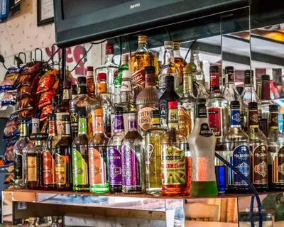 a display of bottles of alcohol on a shelf at Econo Lodge Wooster in Wooster