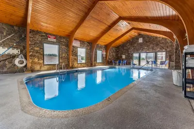 a large indoor swimming pool with a wooden ceiling at Econo Lodge Wooster in Wooster