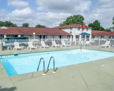 a large swimming pool in front of a hotel at Econo Lodge Inn & Suites Sandusky South in Sandusky