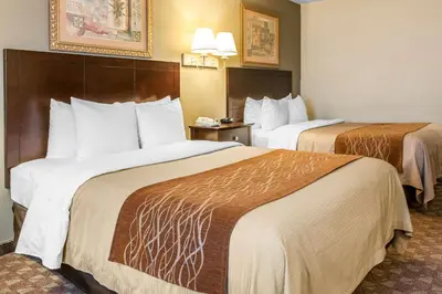 a hotel room with two beds in a room at Quality Inn Defiance in Defiance