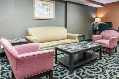 a waiting room with a couch and two chairs at Quality Inn Defiance in Defiance