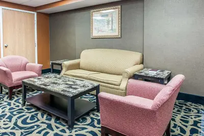 a waiting room with chairs and a couch and tables at Quality Inn Defiance in Defiance