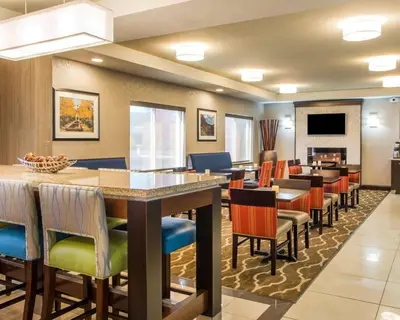 a large dining room with a large table and chairs at Comfort Suites Columbus West - Hilliard in Columbus