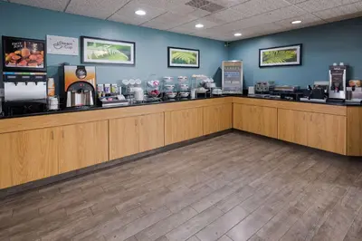 a cashier counter in a coffee shop with a customer at Sleep Inn & Suites Port Clinton in Port Clinton