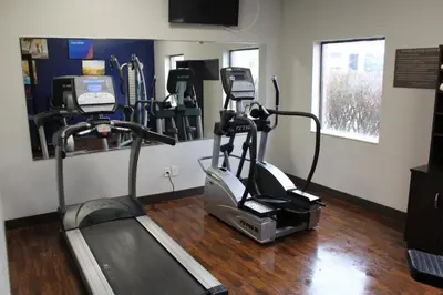 a gym with a treadmill and other tread machines at Comfort Suites Miamisburg - Dayton South in Miamisburg
