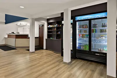 a store with a refrigerator with drinks in it at Comfort Inn & Suites Fremont in Fremont