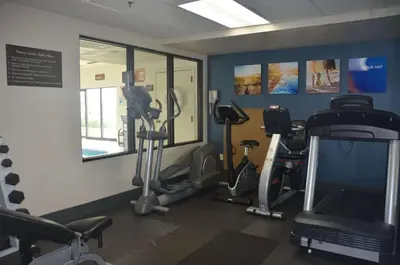a gym with several tread machines in a room at Comfort Inn & Suites Maumee - Toledo I80-90 in Maumee