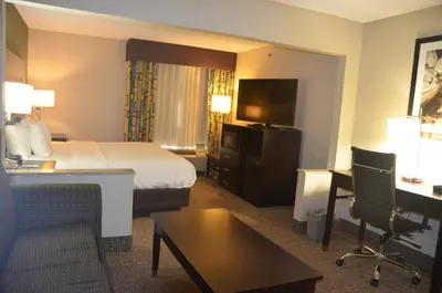 a hotel room with a bed and a desk at Comfort Inn & Suites Maumee - Toledo I80-90 in Maumee