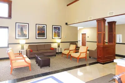 a waiting room with a couch and chairs at Comfort Suites Twinsburg in Twinsburg