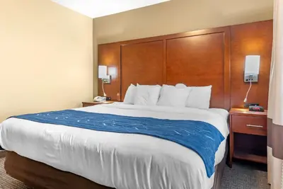 a bed in a hotel room with a large bed at Comfort Suites Findlay I-75 near Sports Complex in Findlay