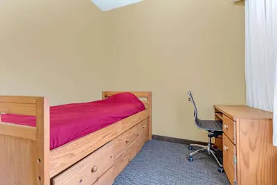 a bedroom with a bed and a desk and a chair at Comfort Suites Findlay I-75 near Sports Complex in Findlay