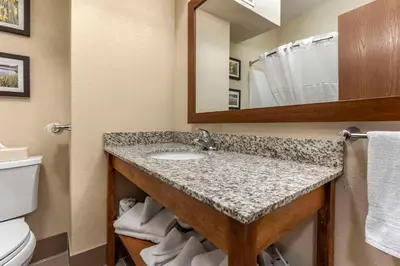 a bathroom with a sink and a toilet at Comfort Inn & Suites Streetsboro - Kent in Streetsboro