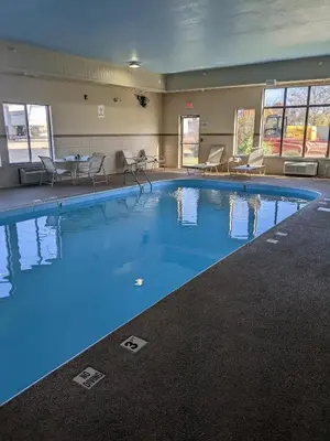 a large pool with blue water in a hotel room at Quality Inn & Suites Delaware South in Delaware