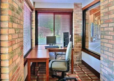 an office with a desk and a computer on a balcony at Quality Inn East Liverpool - Calcutta in East Liverpool
