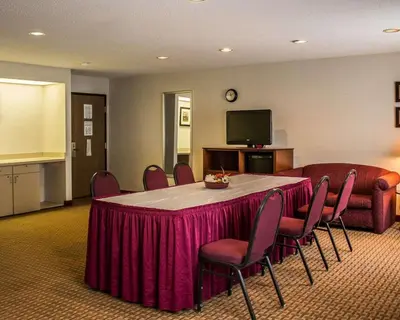 a conference room with a table and chairs and a tv at Quality Inn East Liverpool - Calcutta in East Liverpool