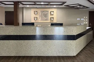 a lobby with a check in counter in a building at Comfort Inn Maumee - Perrysburg Area in Maumee