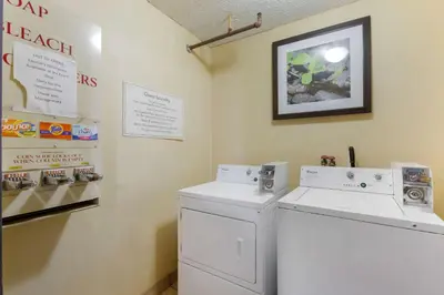 a laundry room with a white washer and dryer at Quality Inn Alexis Rd in Toledo